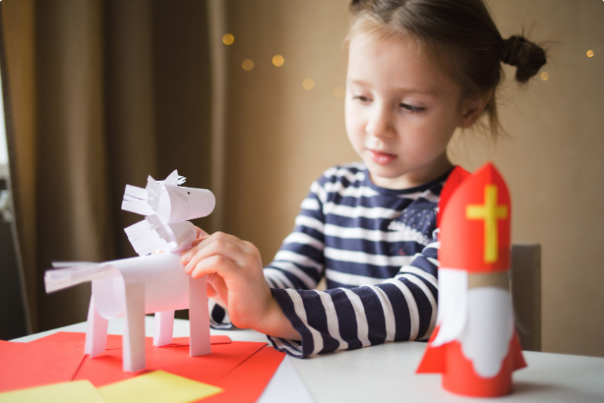 a child playing with homemade toy.