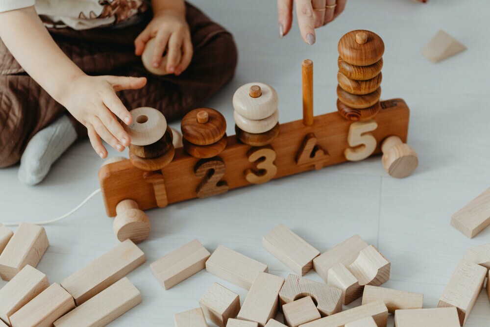 a child playing with number block toys-learning educational toys for children.